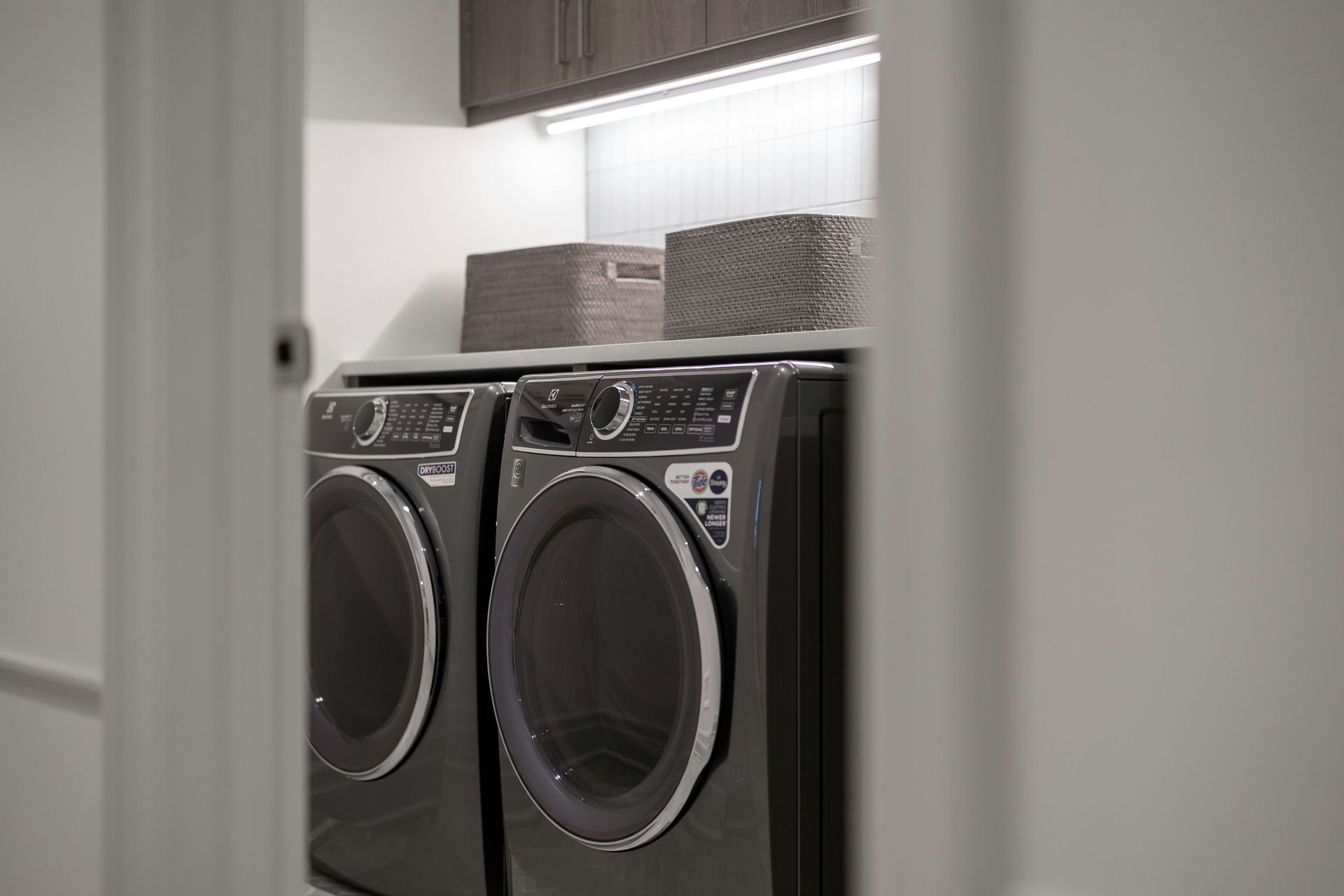 Modern laundry room with matching washer and dryer